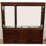 A late 19th/early 20th century and later stained wood museum display cabinet, the moulded cornice