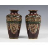 A pair of Chinese cloisonné vases, 19th century, each of tapered cylindrical from and decorated with