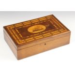 A late 19th century mahogany Killarney box, the central oval boxwood cartouche inlaid with a fort on