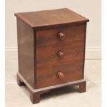 A mid 19th century mahogany chest, of small proportions, the rectangular crossbanded top above three