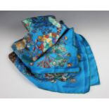 A 'Hermes' style scarf, designed with fans and spraying foliage, against a turquoise ground,