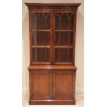 A George III style mahogany library bookcase, late 20th century, the moulded cornice above a pendant