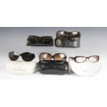 Four pairs of cased designer prescription sunglasses, comprising: a pair of Ray-Ban "Wayfarer" sungl