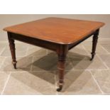 A Victorian mahogany dining table, the rectangular top with rounded corners and moulded edge, raised