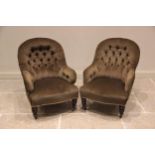 A pair of Victorian tub type chairs, upholstered in green velour fabric, each with an arched