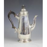 A late Victorian silver coffee pot, London 1899 (maker's marks worn), of tapering cylindrical form