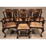 A set of twelve Chippendale style mahogany dining chairs, early 20th century, each with a pierced,