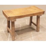 A sycamore butchers block, late 19th/early 20th century, of gnarled and worn rectangular form,