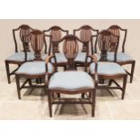A well matched set of twelve mahogany Hepplewhite style dining chairs, to include a set of seven