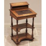 A Victorian walnut davenport / etagere, the hinged stationery compartment above a skiver inset
