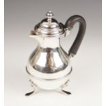 A Victorian silver chocolate pot, William Devenport, Birmingham 1897, of baluster form with beaded