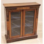 A Victorian rosewood pier cabinet, the rectangular top above a frieze inlaid with a foliate motif