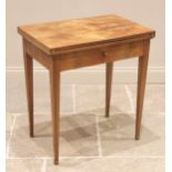 An early 20th century walnut game/writing table by John Bagshaw, Liverpool, the quarter veneered top