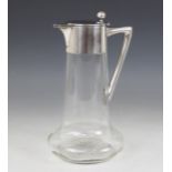 A Christopher Dresser style German silver mounted cut glass claret jug by Wilhelm Binder, of