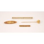 A diamond 14ct gold bar brooch, the central single cut diamond measuring 1.5mm diameter, claw set to