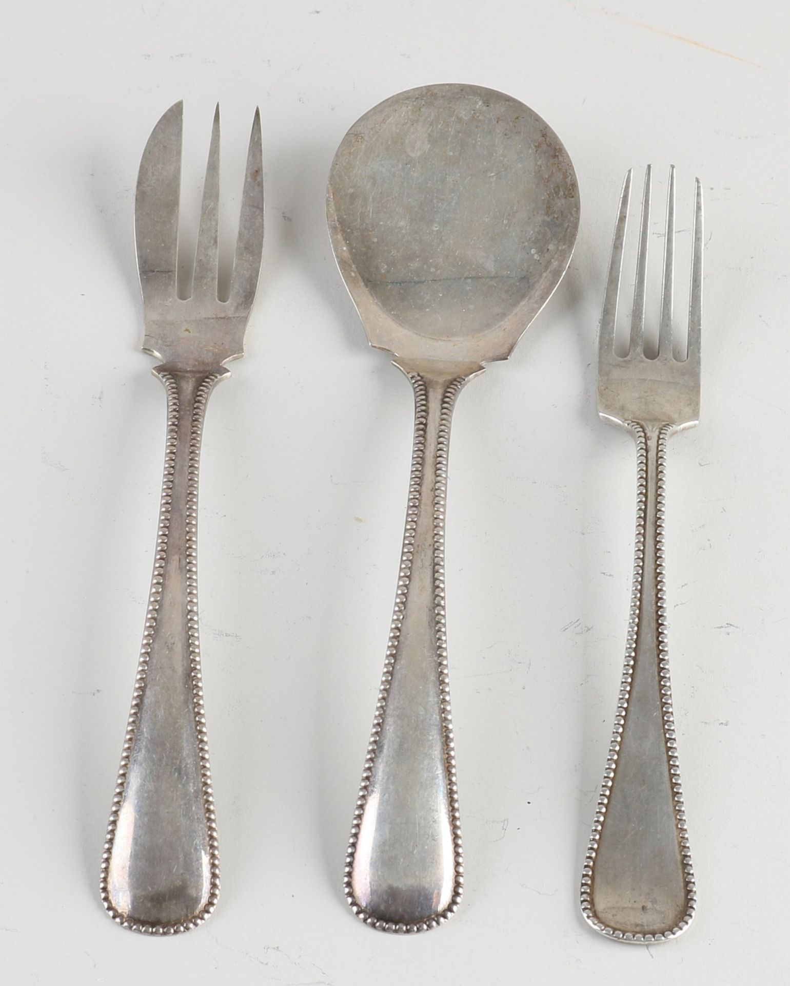 Three parts silver cutlery