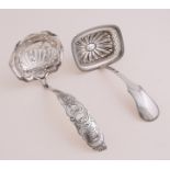 Two silver spreaders