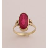 Gold ring with red stone