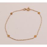 Gold bracelet with hearts
