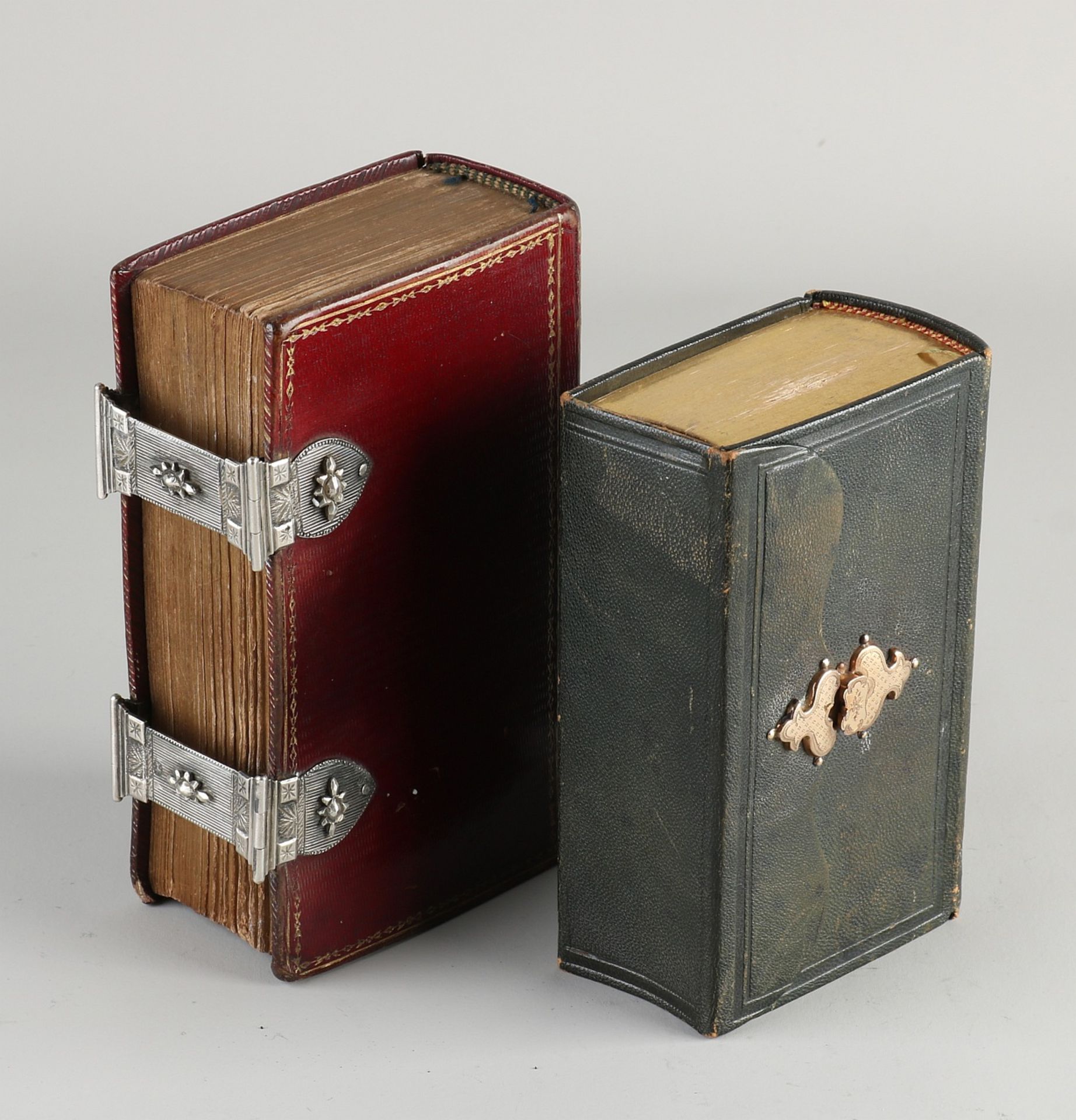 Two bibles with silver and gold lock