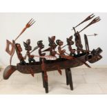 African woodcarved boat with warriors