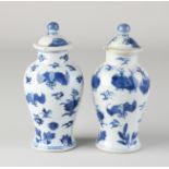 Two 18th century Chinese lidded vases, H 12.5 cm.