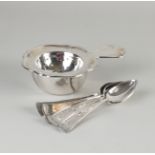 Silver tea strainer and spoons