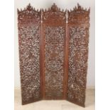 Carved Indonesian teak folding screen