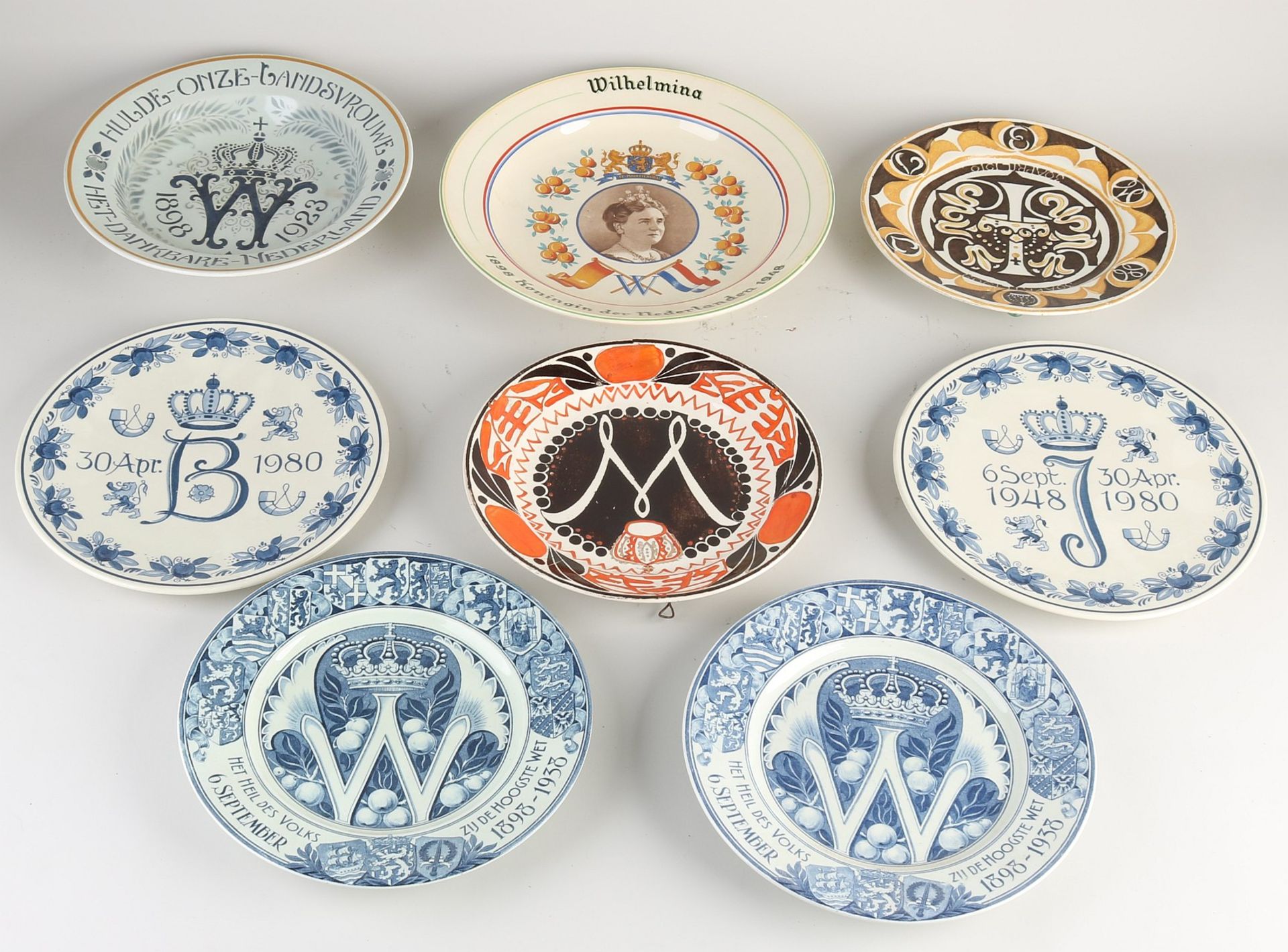 Eight old/antique wall plates