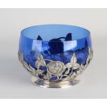 Silver bowl with blue glass