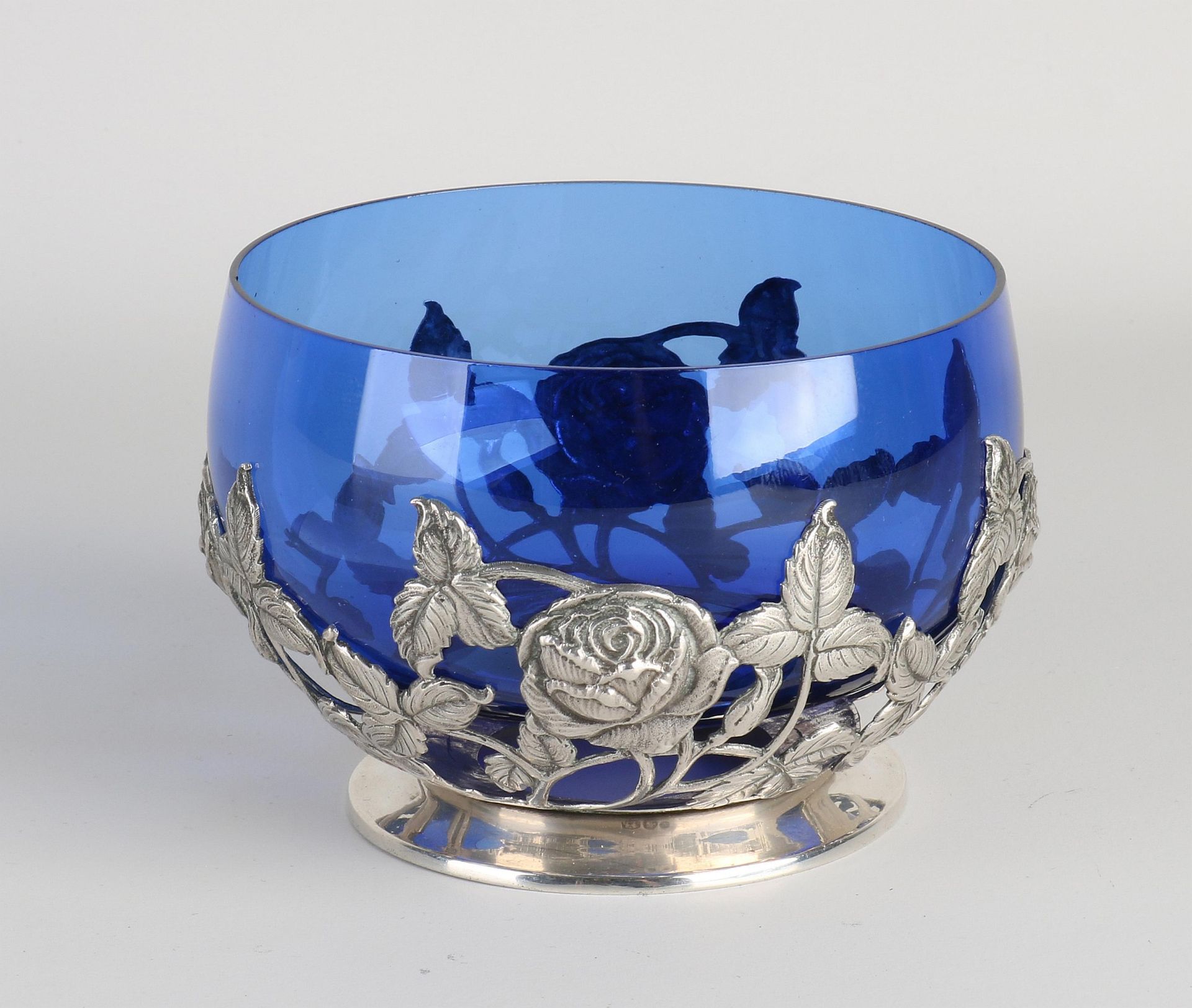 Silver bowl with blue glass