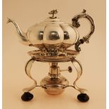Silver teapot with stove