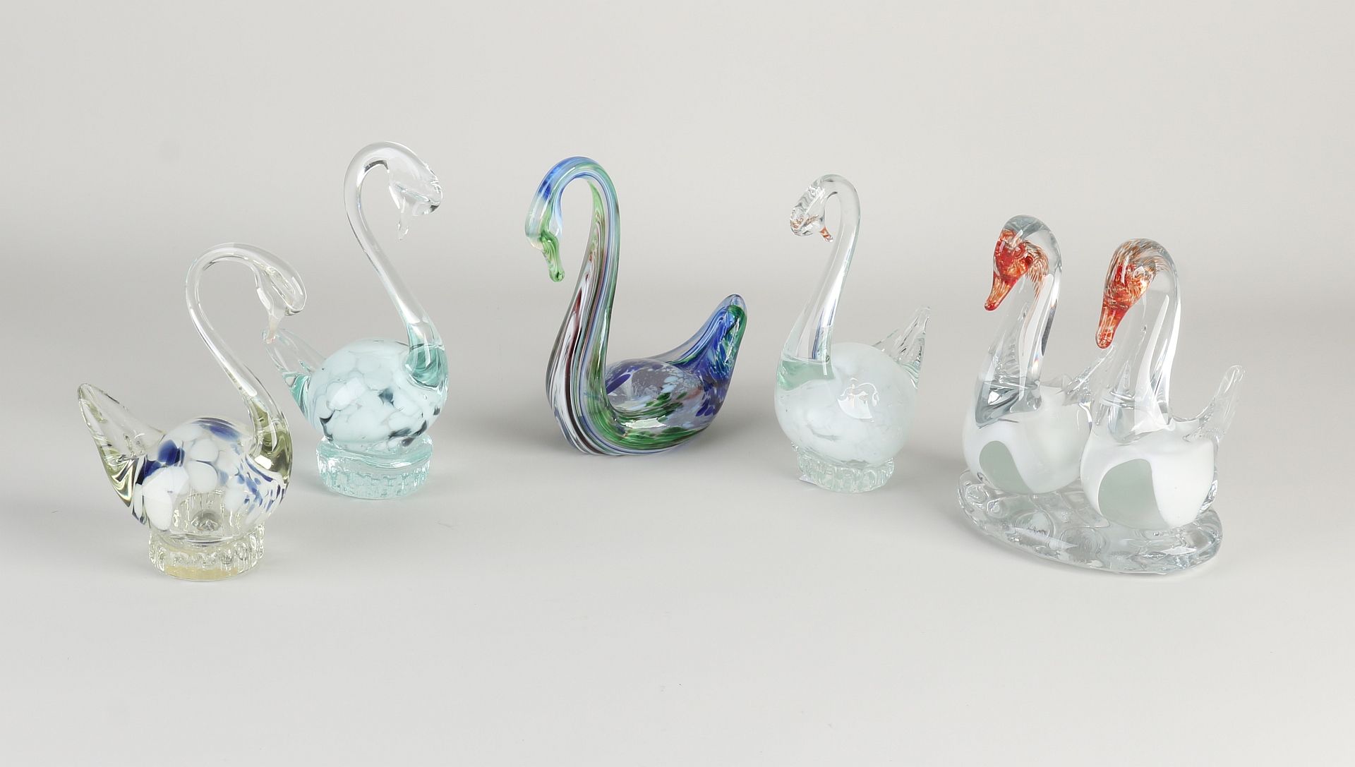 Five glass swan figures