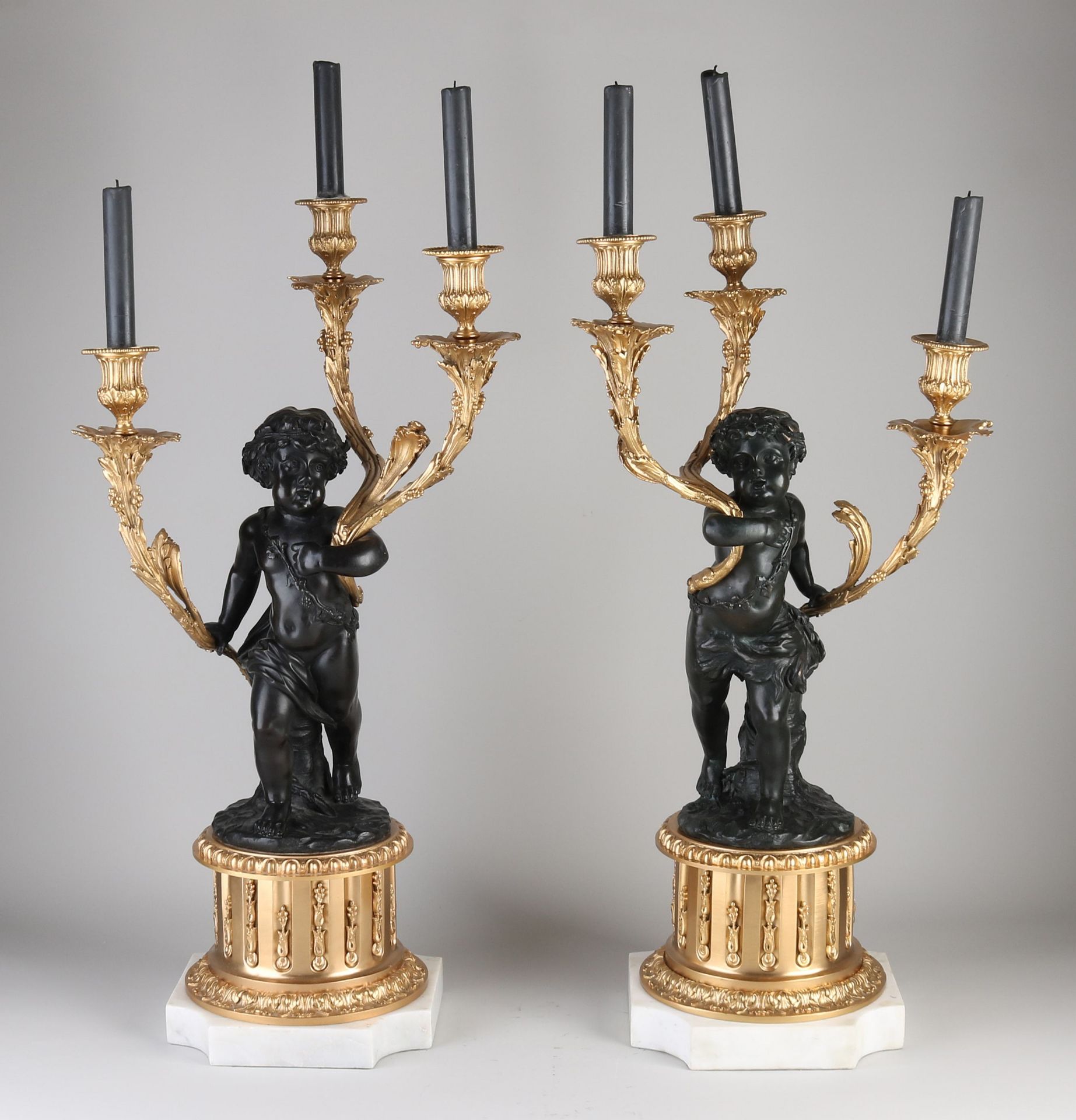 Set candlesticks with putti