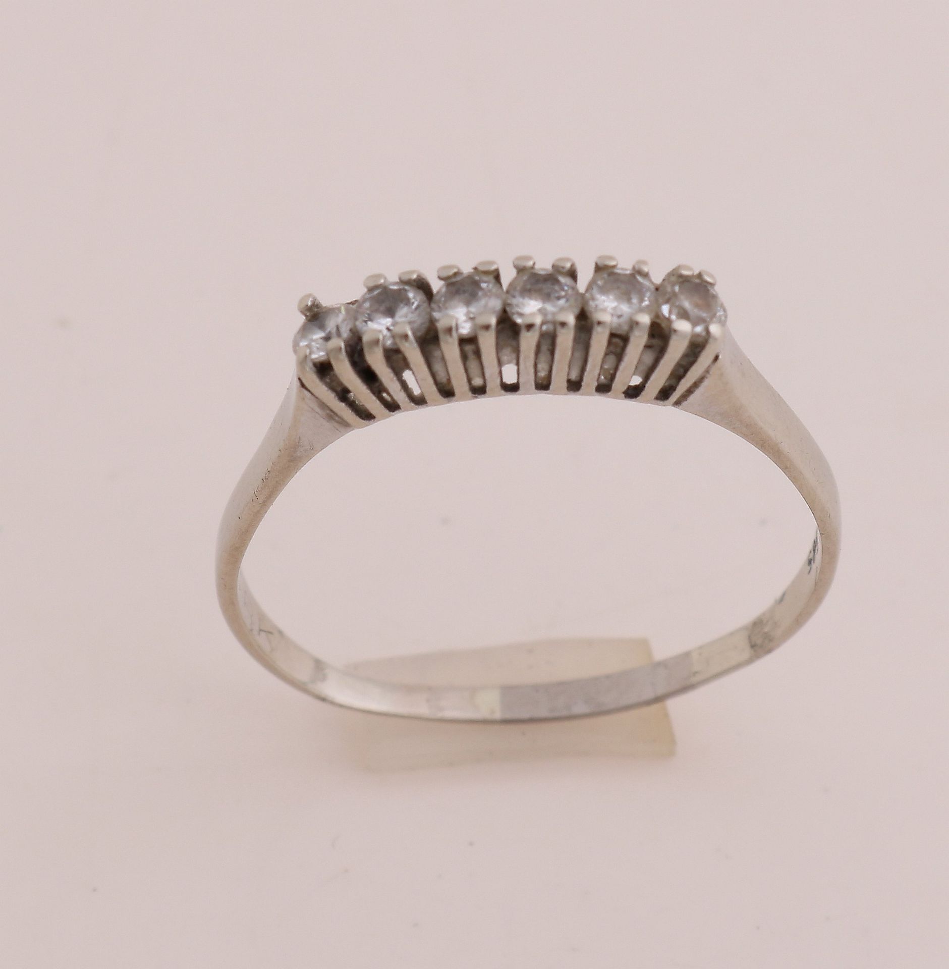 White gold ring with zirconias