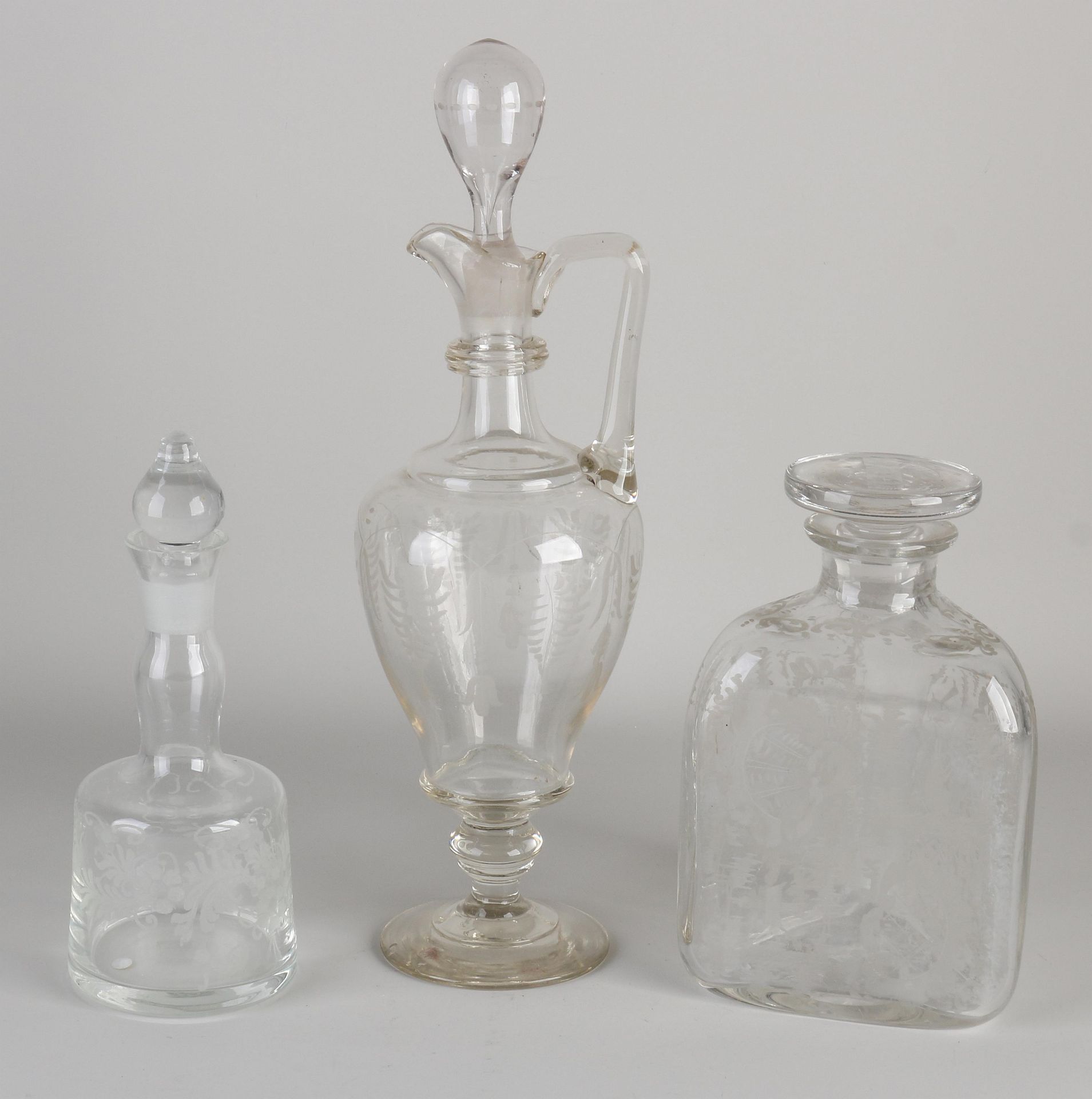 Three mouth-blown carafes