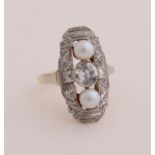 Gold ring with diamond and pearl