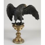 Solid bronze eagle on pedestal