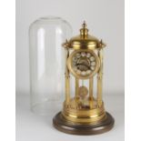 Antique mantel clock under a bell jar, 1900