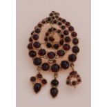 Gold brooch with garnet