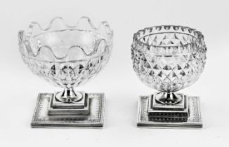 Two silver salt shakers