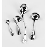 Four silver serving spoons