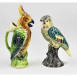 Two ceramic parrots