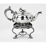 Silver teapot on stove