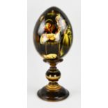 Russian lacquer egg on console, H 24 cm.