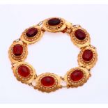 Gold bracelet with garnet