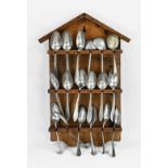 Antique spoon rack with tin spoons, 1900