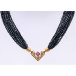 Hematite necklace with gold lock