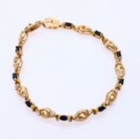 Gold bracelet with sapphire