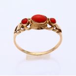 Gold ring with red coral